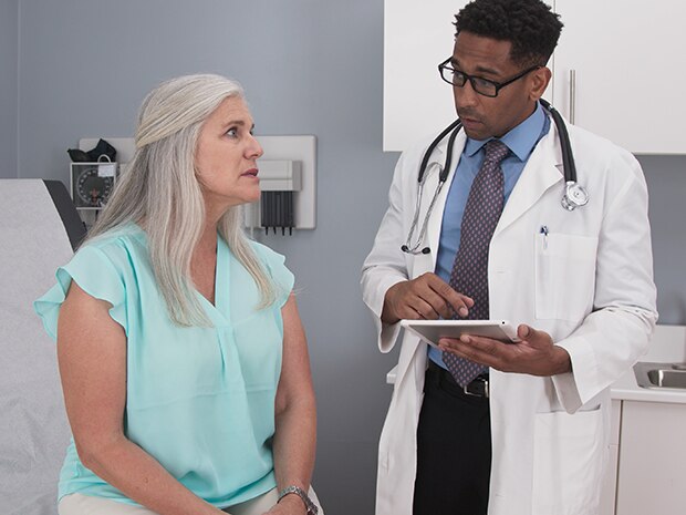 Woman at doctor's office for hernia consultation