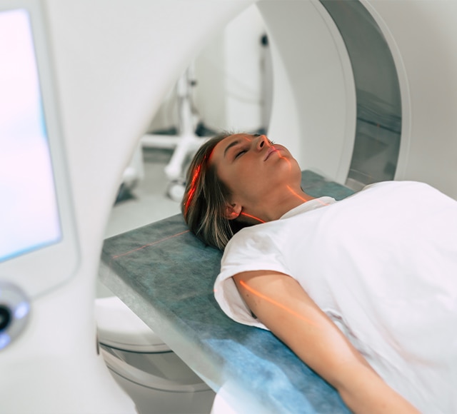 Young female patient going through an MRI scan