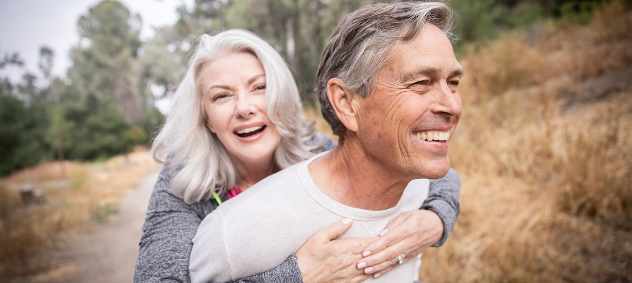 Couple smiling on a hike